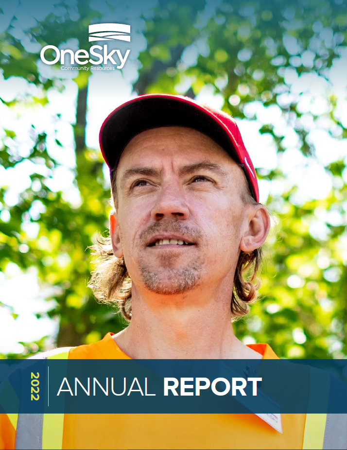 Cover photo of annual report that shows a man in hazard coveralls and orange hat looking into the distance.